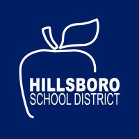 White outline of an apple with a leaf, with Hillsboro School District text on a dark blue background.
