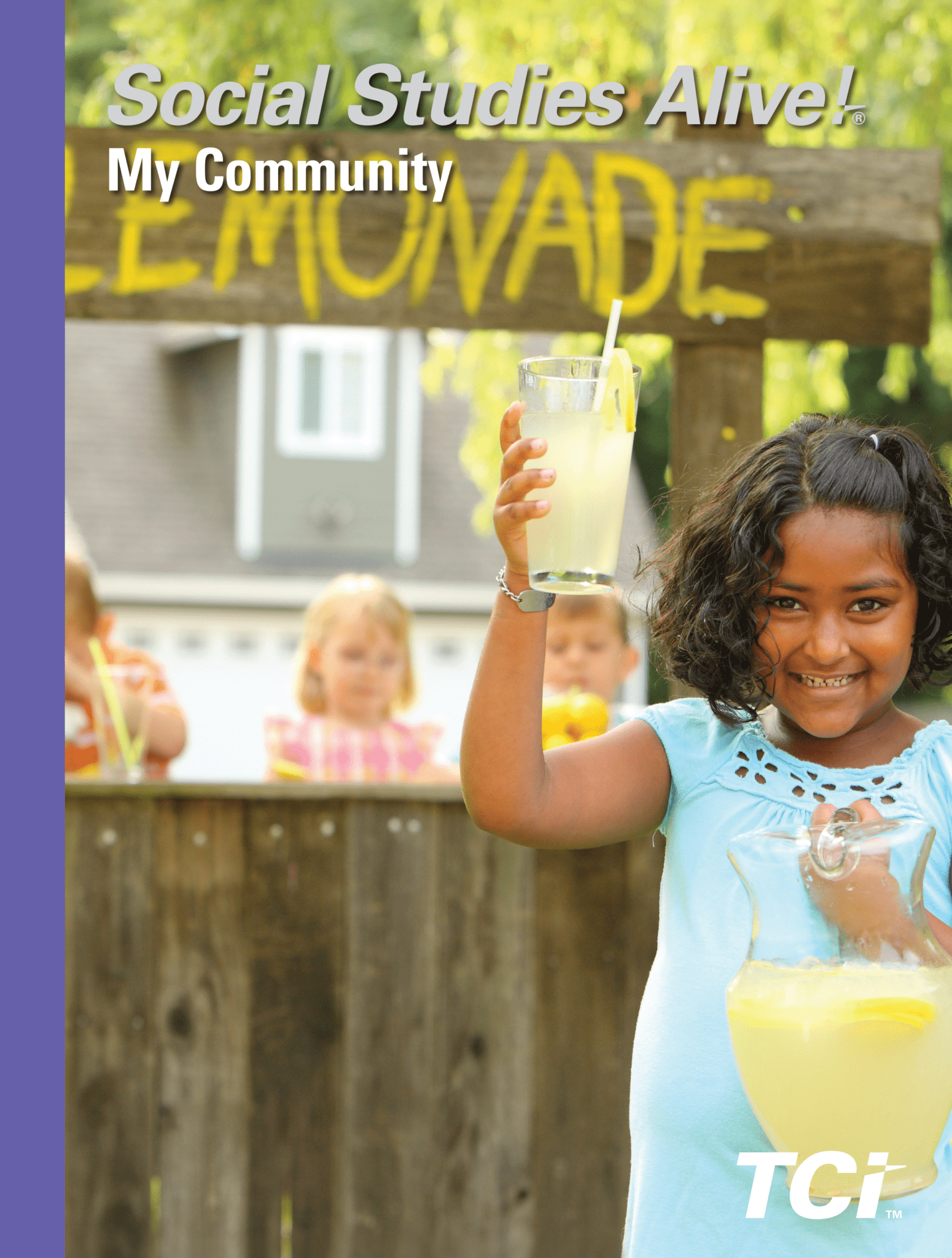 Smiling girl holding lemonade cup at a stand, with children and LEMONADE sign in the background.