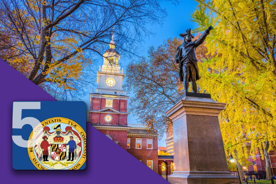 A statue near Independence Hall with autumn trees, a Maryland state seal, and a large number 5 overlay.